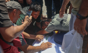 PHOTOS: Palestinians mourn after Israel strikes makeshift prayer hall at al-Shati refugee camp