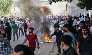 32 dead in Bangladesh unrest, protesters set fire to state TV network