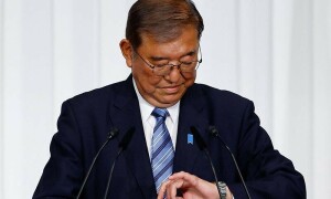 Japan&rsquo;s PM vows to stay on despite election debacle