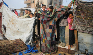 Israeli forces kill 22 people in Gaza, force new displacement