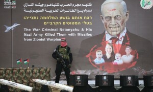 Hamas displays four coffins on stage before hostage body handover