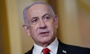 Israeli PM visits West Bank camp, tells army to step up raids after blasts on buses