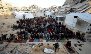 Palestinians hold Eid prayers as Israeli attacks continue