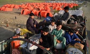 Fleeing Pakistan, Afghans rebuild from nothing