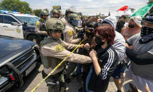 Curfew in LA as protests spread across US despite Trump threats