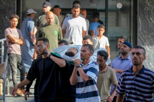 At least 21 Palestinians killed, including 11 waiting for aid, across Gaza