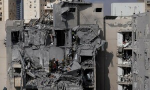 PHOTOS: Emergency personnel work at an impacted site in Beersheba following a missile attack from Iran