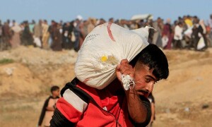 9 Palestinians queuing for aid killed in central Gaza