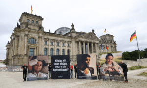 PHOTOS: Protesters in Berlin hold pictures of wounded Gaza children outside govt building