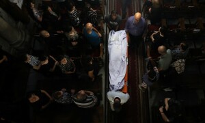PHOTOS: Mourners attend funeral of those killed in Gaza church attack