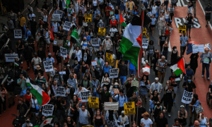 PHOTOS: People march as they participate in a &lsquo;Stop Starving Gaza Now&rsquo; protest in New York City