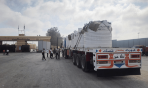 PHOTOS: Trucks carrying aid for Gaza Strip wait at the Rafah border crossing in Egypt
