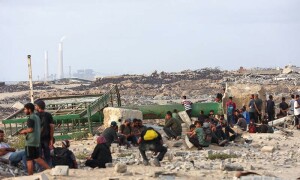 PHOTOS: Palestinians bring back aid parcels after trucks enter Gaza Strip