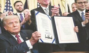 Trump inks stablecoin law to ‘buttress dollar status’