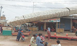 Monument crashes onto shops