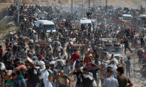 PHOTOS: Palestinians carry aid supplies from US-backed GHF in central Gaza Strip