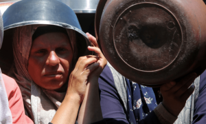 PHOTOS: Palestinians wait to receive food from a charity kitchen amid a hunger crisis in Khan Younis
