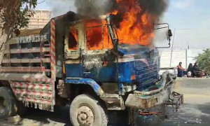 2 killed in accident as mob torches 7 dumper trucks in Karachi