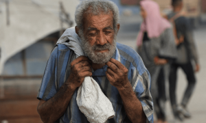 PHOTOS: Palestinians seek aid supplies from trucks that entered Gaza through Israel