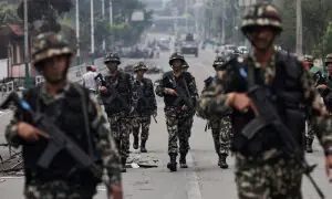 Soldiers guard Nepal’s parliament, patrol streets after two days of deadly protests