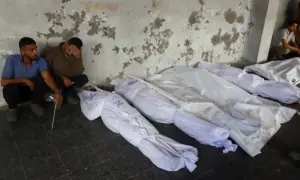 PHOTOS: Gazans mourn Palestinians killed in Israeli strike on building sheltering displaced people