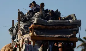 PHOTOS: Displaced Palestinians make their way back to north