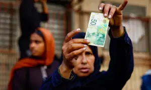 As the guns fall silent, Gazans find newly-reopened banks have no cash
