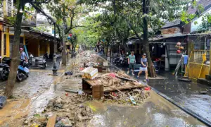 Vietnam flooding death toll rises to 55 as rescuers race to find more than a dozen missing