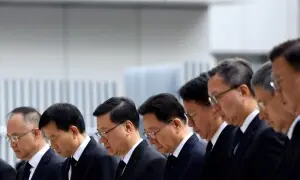 Hong Kong mourns victims of blaze that killed 128 and counting