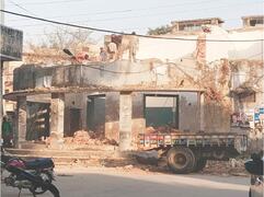 Parts of colonial-era building being demolished
