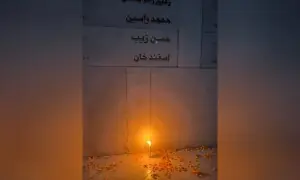 Relatives of APS victims mark 11th anniversary of school massacre with candlelight vigil