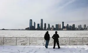 Winter storm kills dozens as cold lingers in central and eastern US