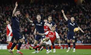 Quadruple chasing Arsenal rout Wigan to reach FA Cup fifth round