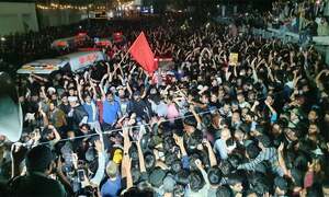 Thousands attend funeral of seven killed near US consulate in Karachi