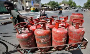 Graveyard raid in India uncovers hidden cooking gas canisters amid shortage