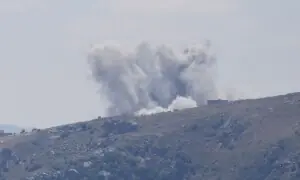 PHOTOS: Smoke rises following an Israeli air raid on the southern Lebanese village of Yohmor