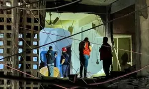 PHOTOS: First responders, residents inspect damage after Israeli strike in Lebanon's Sidon