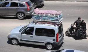 PHOTOS: Lebanese flee country's south for Beirut before Israel-Hezbollah ceasefire