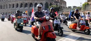 Thousands ride through Rome as Vespa celebrates 80 years