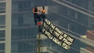 Russian daredevils unfurl banner atop New York's Empire State Building in proposal stunt