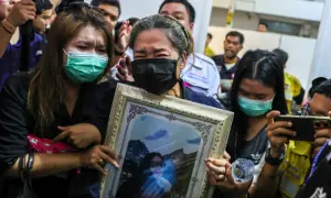 Families claim bodies as Bangkok fire toll rises to 30