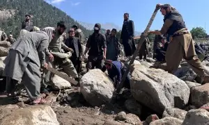 Afghans search for dozens missing, some with bare hands, after devastating flood in Nuristan province