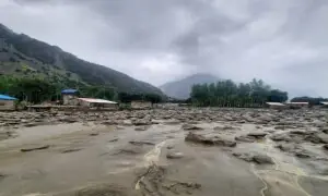 Torrential rains disrupt travel across GB as floods wash away roads, bridges