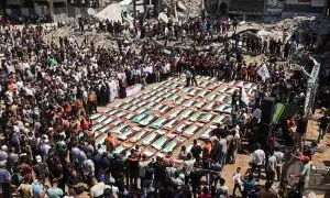 Palestinians mourn 112 people retrieved from rubble in Gaza