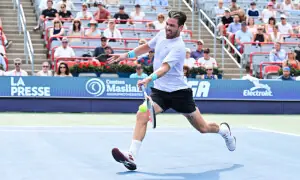 Battling Cameron Norrie survives match point to oust de Minaur