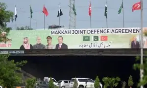 Islamabad police hold flag march to celebrate joint defence agreement