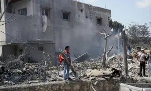 PHOTOS: First responders search site of Israeli strike in southern Lebanon