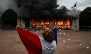Smashed storefronts, torched cars and graffiti &mdash; France protests and their aftermath in pictures
