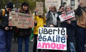 Protesters hold placards during an authorised demonstration organised by labour unions in Paris as part of nationwide protests called by the 'Yellow Vests' movement joined by French high school and university students against the cost of living and rising fuel prices, in France October 24, 2026. The slogan reads 'liberty, equality, love'. — Reuters