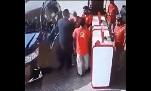 This screengrab of CCTV footage shows a customer who has stepped out of his vehicle at a petrol station in Lahore. — via X/MaryamNSharif